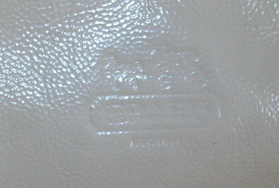 44715 bleecker patent leather top handle pouch stone imprint