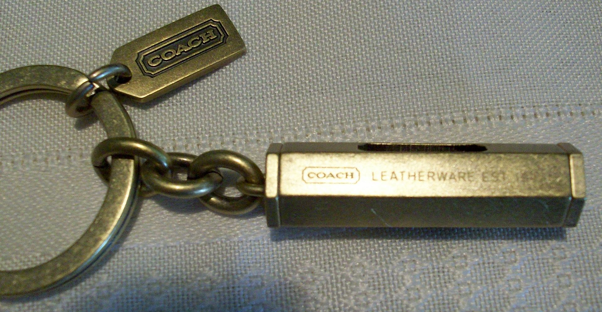 92090 level keychain fob brass